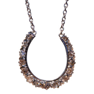 SOLD - The Jument:  Antique Platinum Topped Horseshoe Pendant set with Old Cut Diamonds