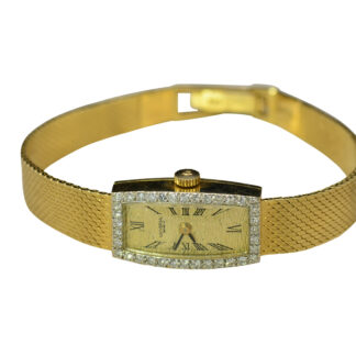 SOLD - The Canaria:  Ladies Universal Geneve Wristwatch in 14K Gold set with Diamonds