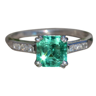 The Centella:  Ladies Platinum Engagement Style Ring set with 1.21 CT Colombian Emerald