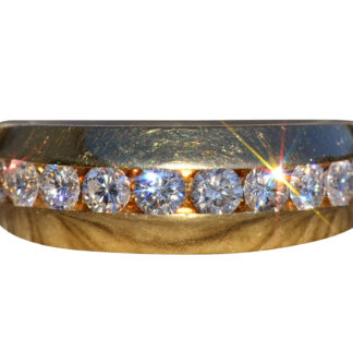 The Narlon:  Yellow Gold Band Channel Set With Diamonds