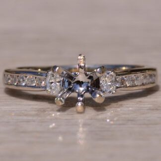 Contemporary Engagement Mounting with Oval Brilliant Cut and Round Brilliant Cut Diamonds