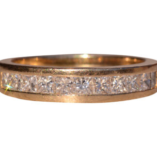 The 153rd Street:  Channel Set Princess Cut Diamond Band in Yellow Gold