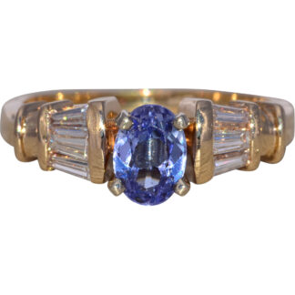 The Tanzanite Sentinel: Tanzanite and Natural Diamond Ring in Yellow Gold