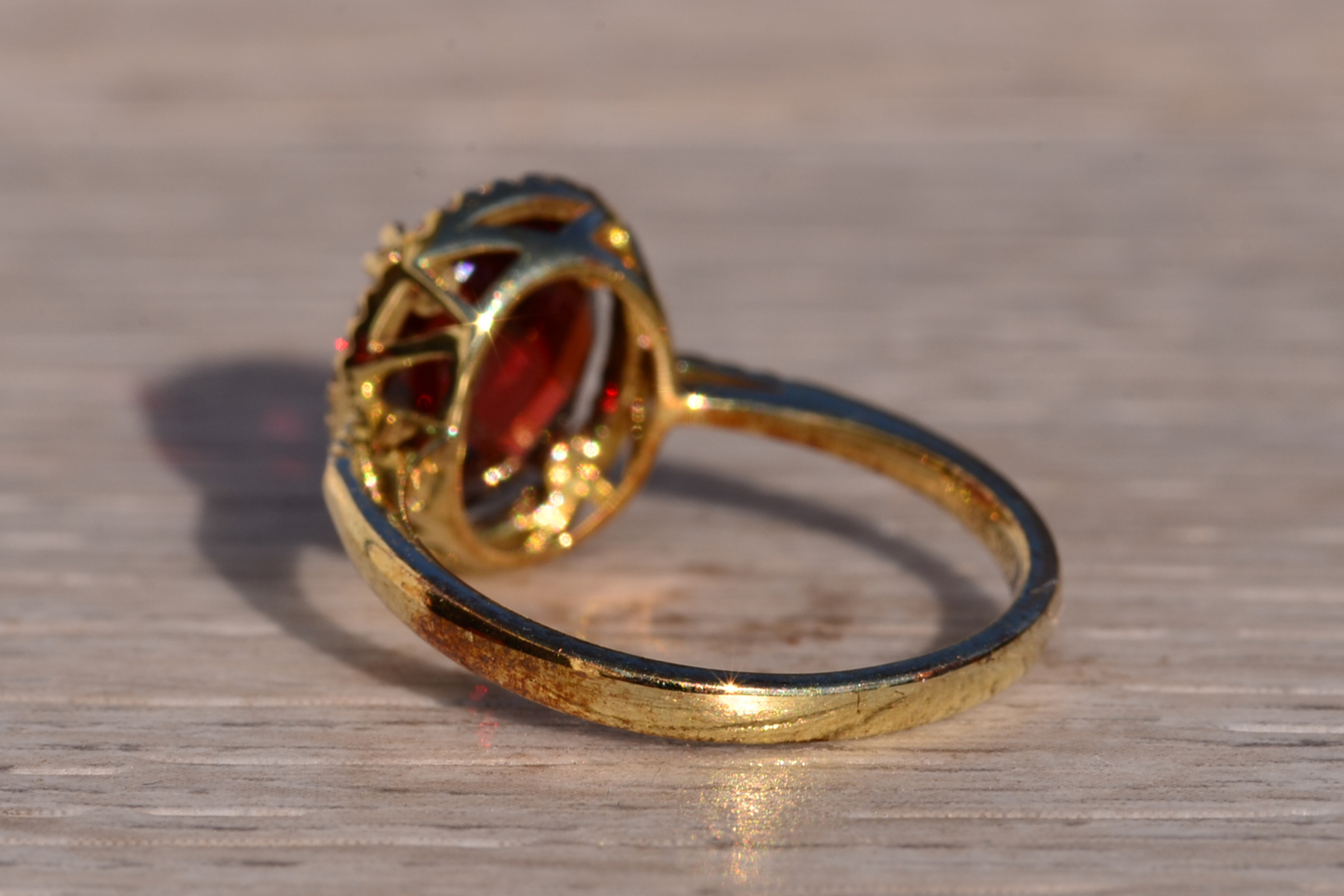SOLD - The 51st Avenue: Oval Checkerboard Cut Garnet and Diamond Halo Ring - Image 4