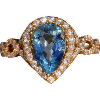 The 30th Avenue: Pear Shaped Aquamarine and Diamond Halo Ring in Yellow Gold