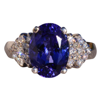 The 153rd Avenue: Oval Brilliant Cut Tanzanite and Natural Diamond Ring in White Gold