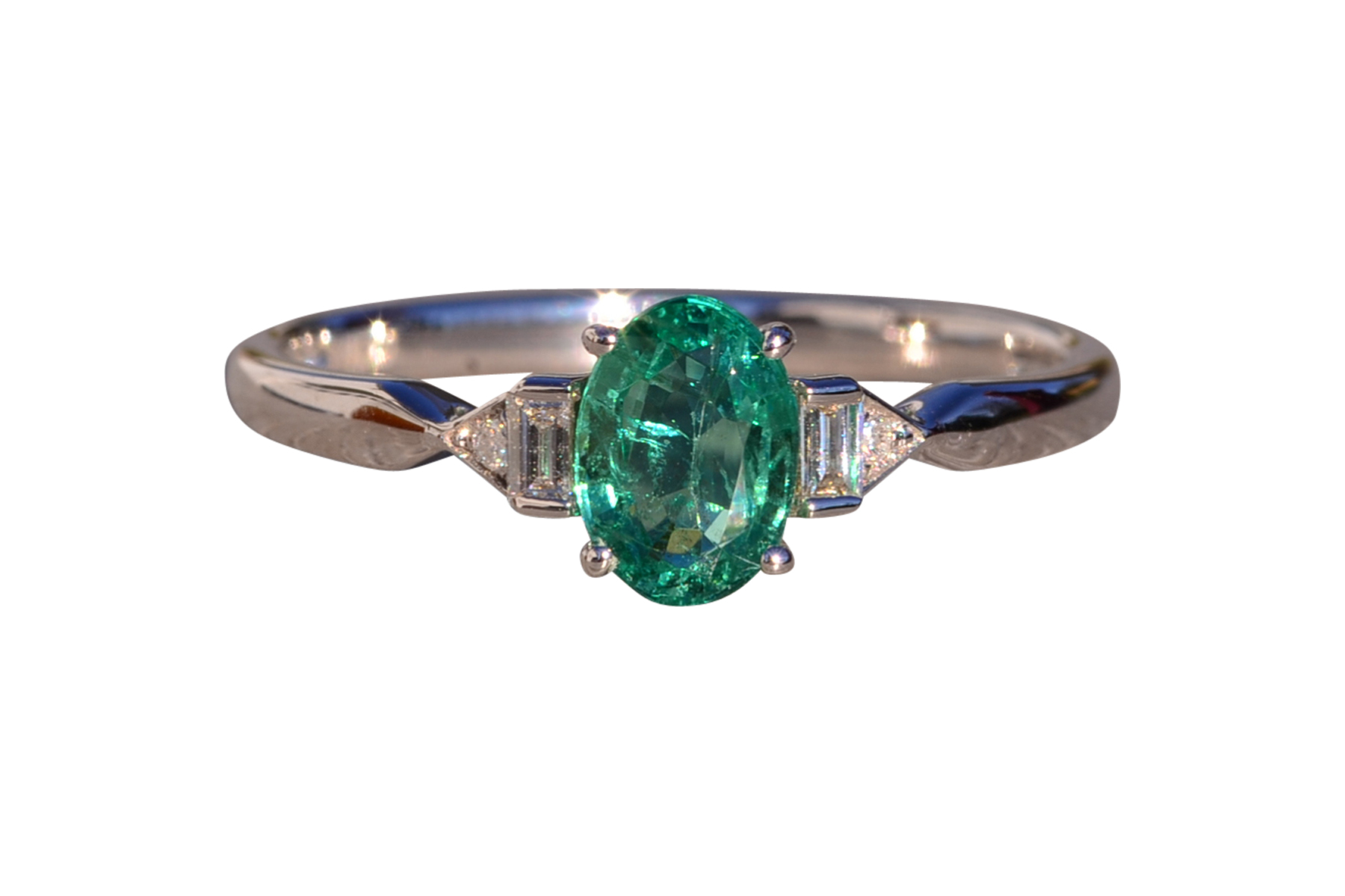 The 163rd Avenue: Vivid Natural Oval Emerald and Natural Diamond Ring