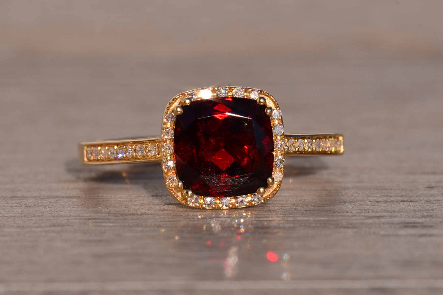 The 119th Avenue: Cushion Shaped Garnet and Natural Diamond Halo Ring in Yellow Gold - Image 2