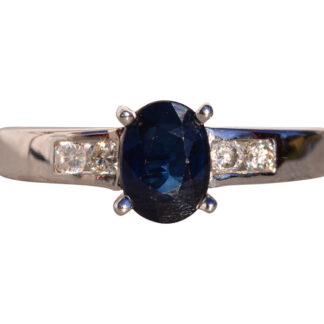 Quatro Calle: Oval Brilliant Cut Midnight Blue Sapphire and Natural Diamond Ring