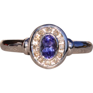 SOLD - The Mount Hayes: Oval Tanzanite and Diamond Halo Ring in White Gold
