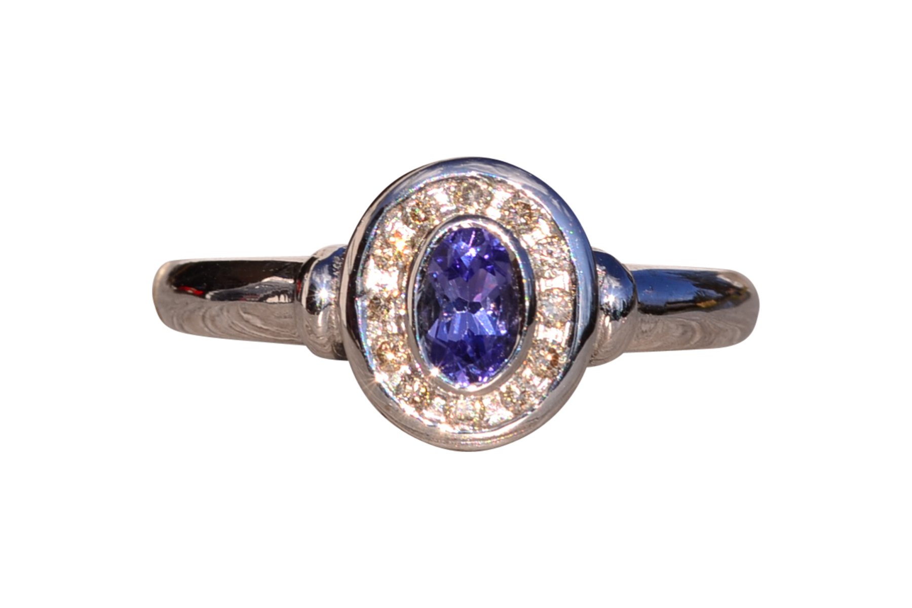 SOLD - The Mount Hayes: Oval Tanzanite and Diamond Halo Ring in White Gold