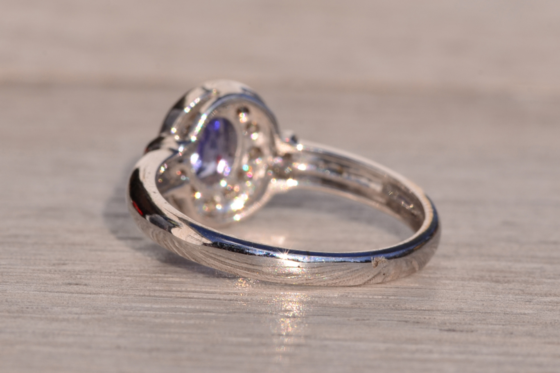 SOLD - The Mount Hayes: Oval Tanzanite and Diamond Halo Ring in White Gold - Image 4