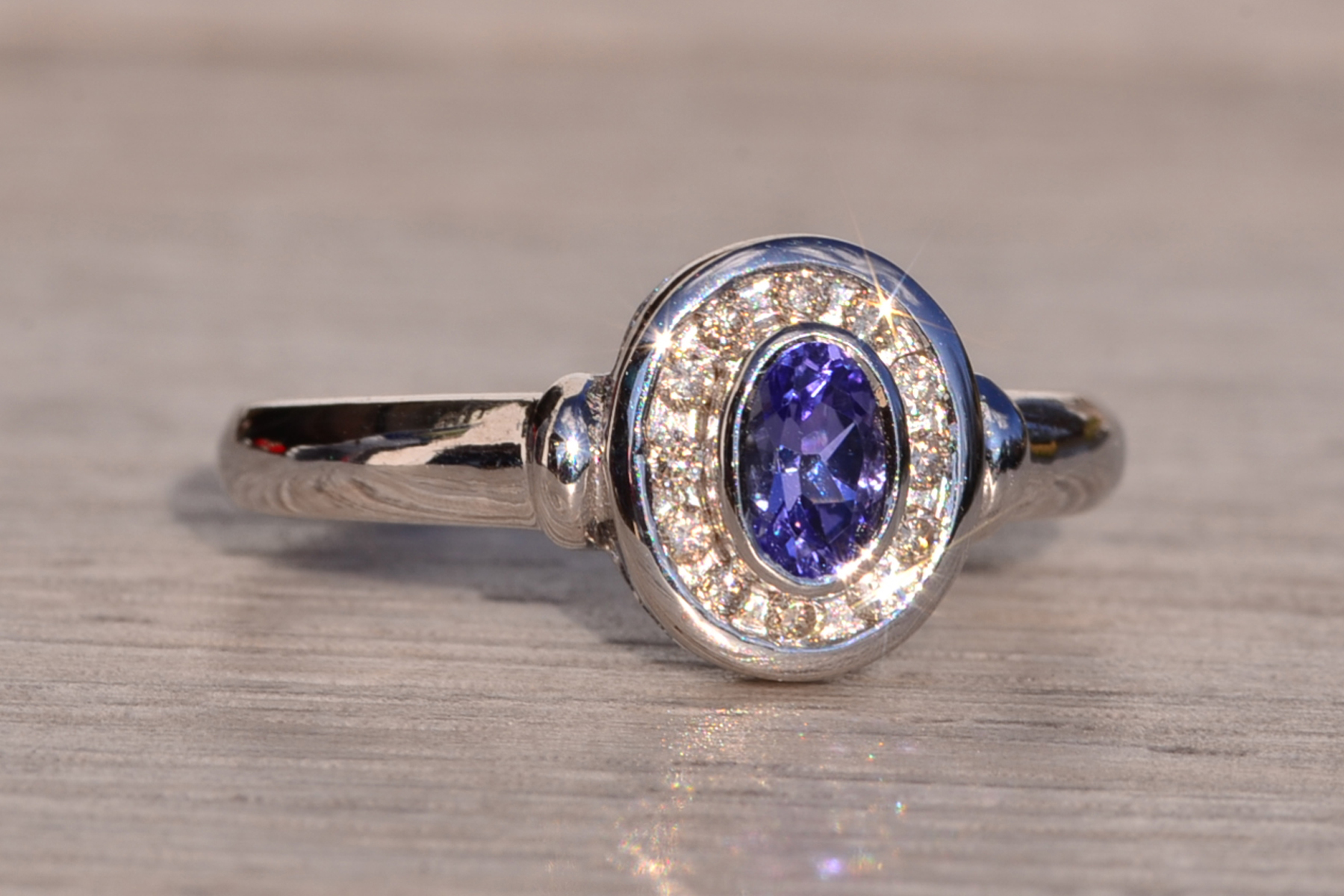 SOLD - The Mount Hayes: Oval Tanzanite and Diamond Halo Ring in White Gold - Image 6