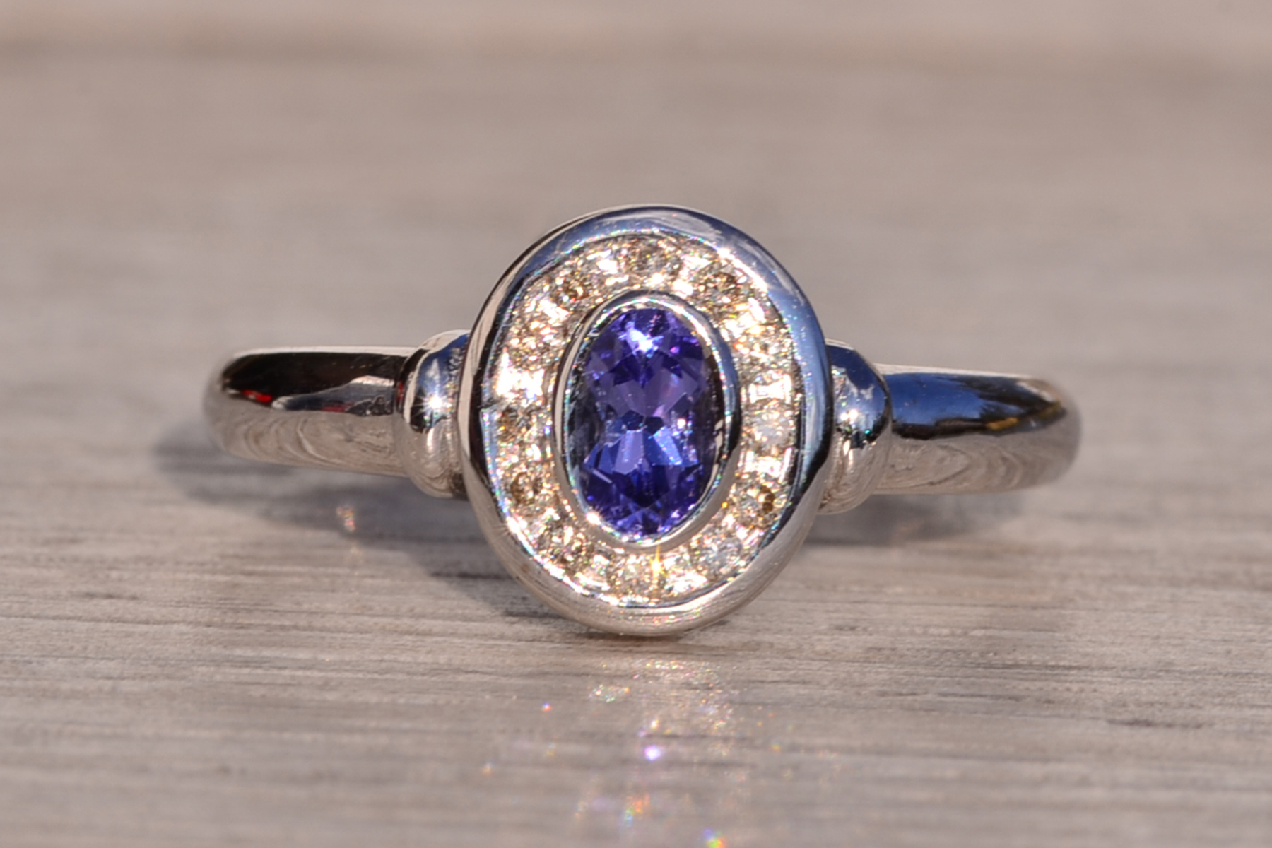SOLD - The Mount Hayes: Oval Tanzanite and Diamond Halo Ring in White Gold - Image 7