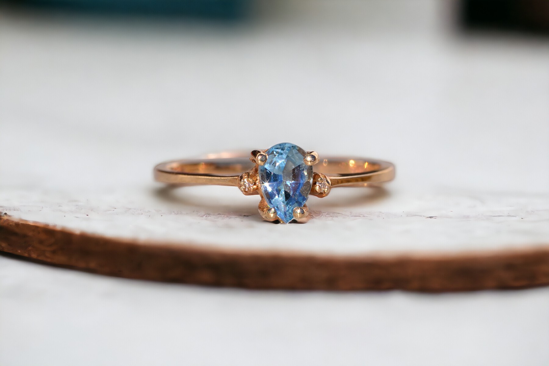 The Tint: Pear Shaped Swiss Blue Topaz and Natural Diamond Ring in Yellow Gold - Image 12