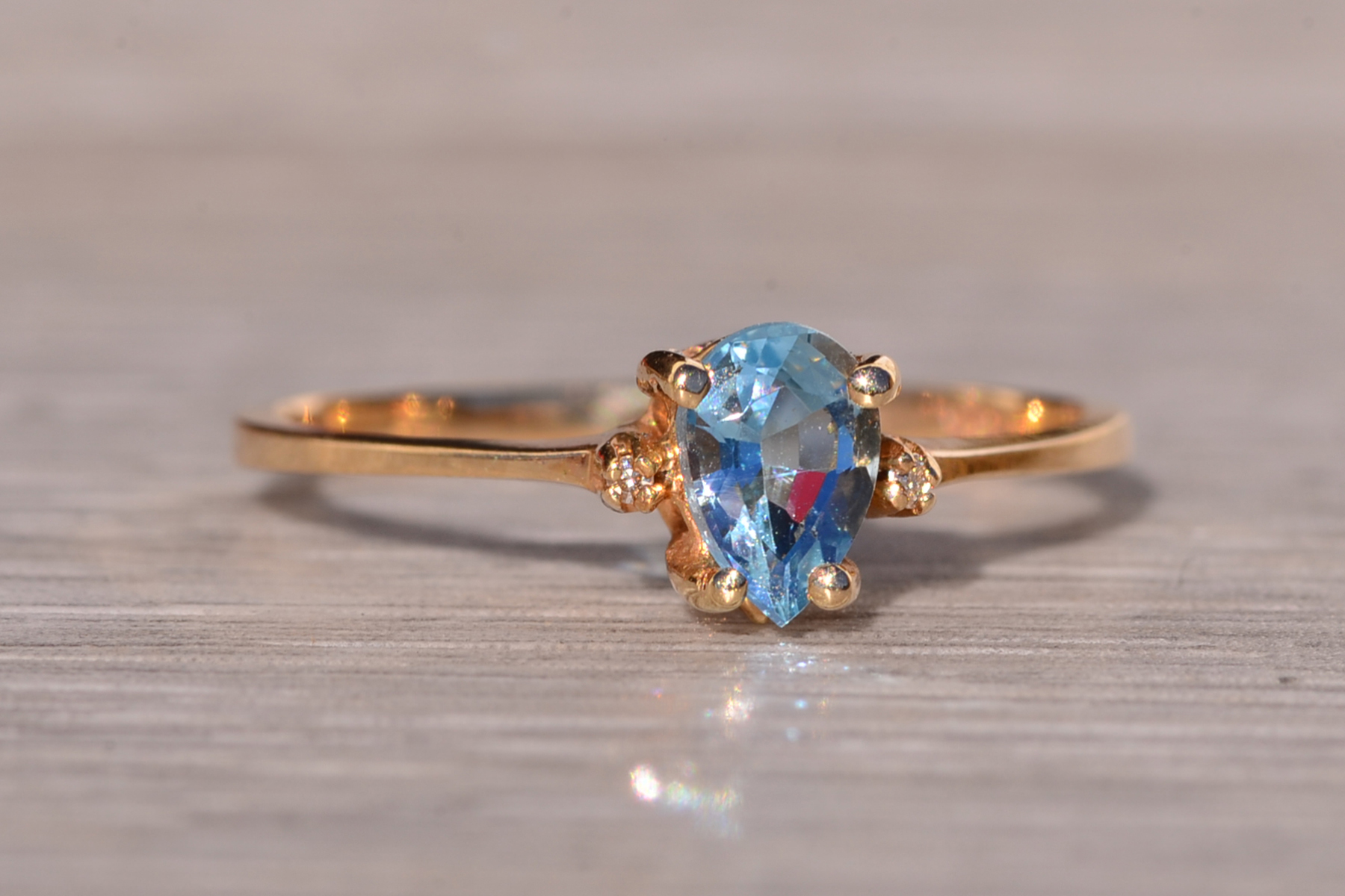 The Tint: Pear Shaped Swiss Blue Topaz and Natural Diamond Ring in Yellow Gold - Image 7