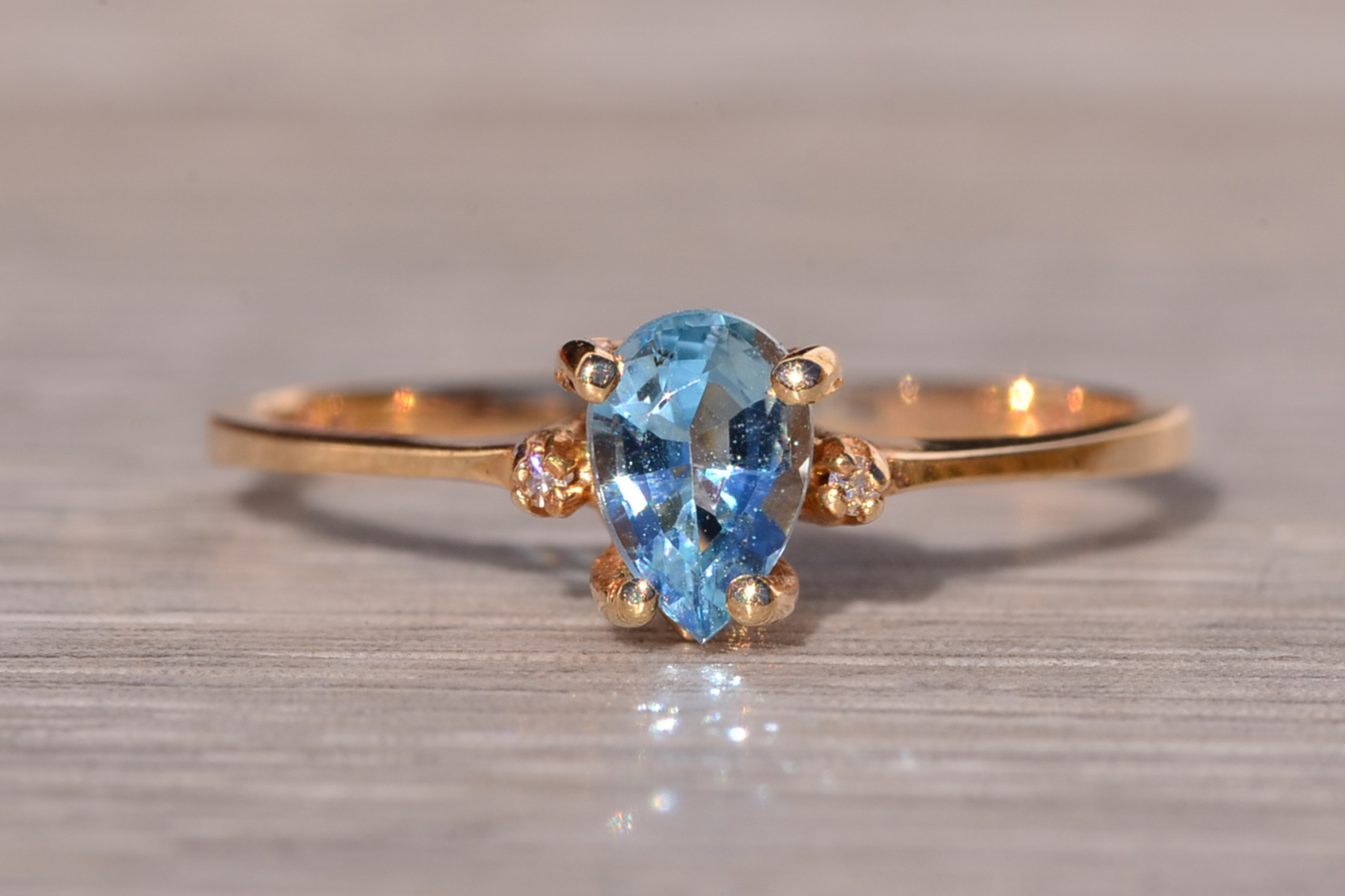 The Tint: Pear Shaped Swiss Blue Topaz and Natural Diamond Ring in Yellow Gold - Image 8