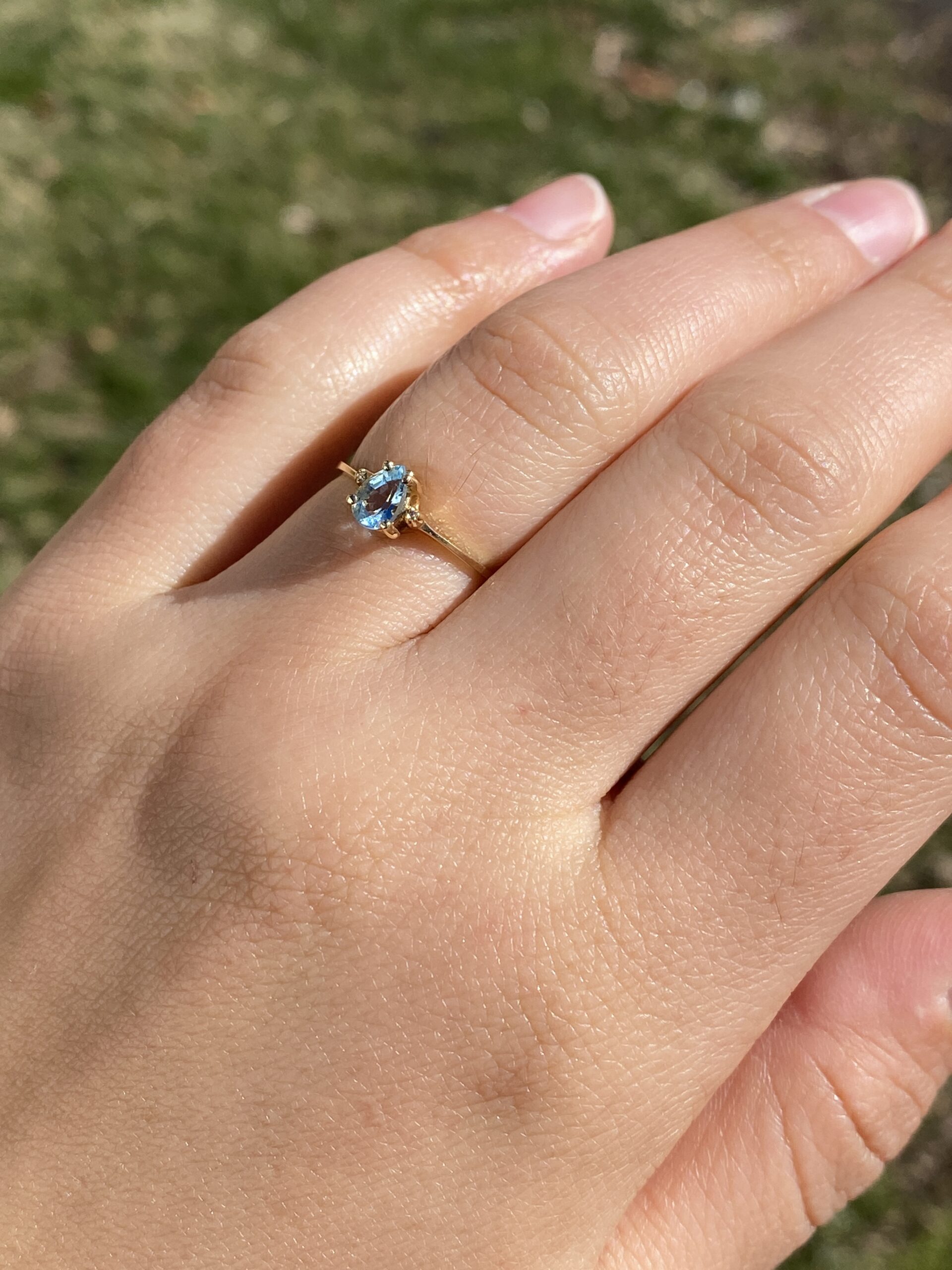 The Tint: Pear Shaped Swiss Blue Topaz and Natural Diamond Ring in Yellow Gold - Image 10