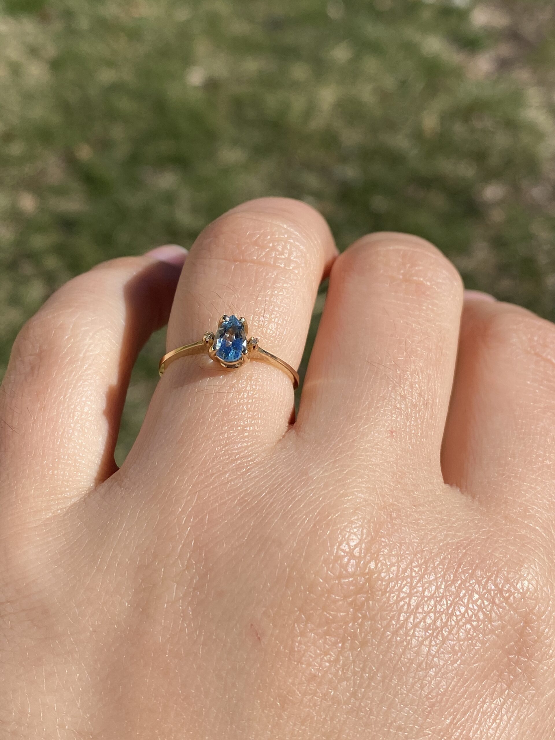 The Tint: Pear Shaped Swiss Blue Topaz and Natural Diamond Ring in Yellow Gold - Image 11