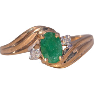 The Vintage Emerald Charm: 1980s Emerald and Diamond Ring in Yellow Gold