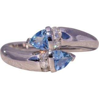 The Ocean's Embrace: Aquamarine and Diamond Bypass Ring in White Gold
