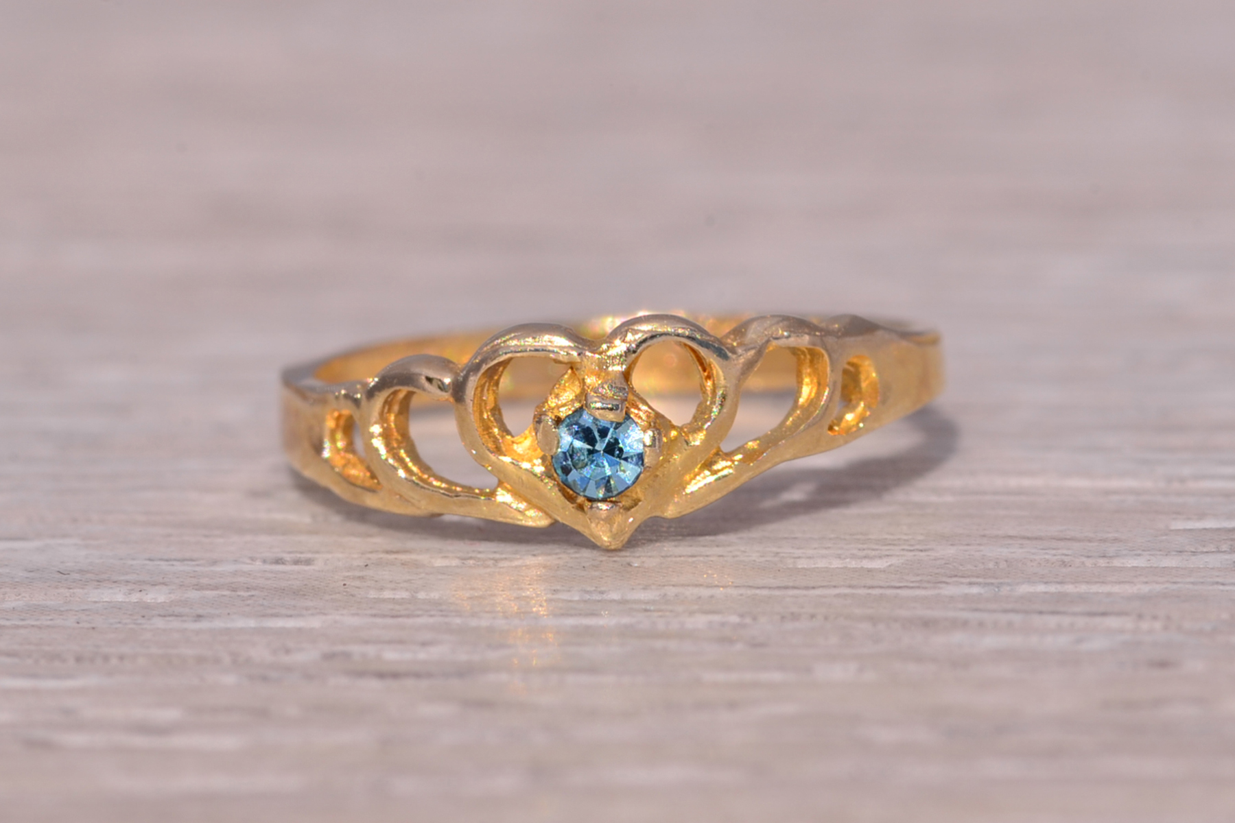 The Little Heart: Child's Blue Crystal Ring in Yellow Gold - Image 2
