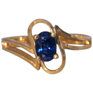 The Midnight Flow: Sapphire Bypass Ring in Yellow Gold