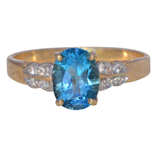 The Azure Crest: Vintage Blue Topaz & Diamond Ring in 14k Yellow Gold
