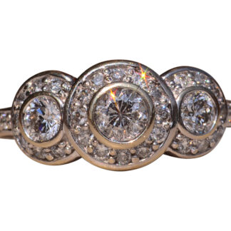 The Coast Road:  Three Stone Halo Ring set with Natural Diamonds