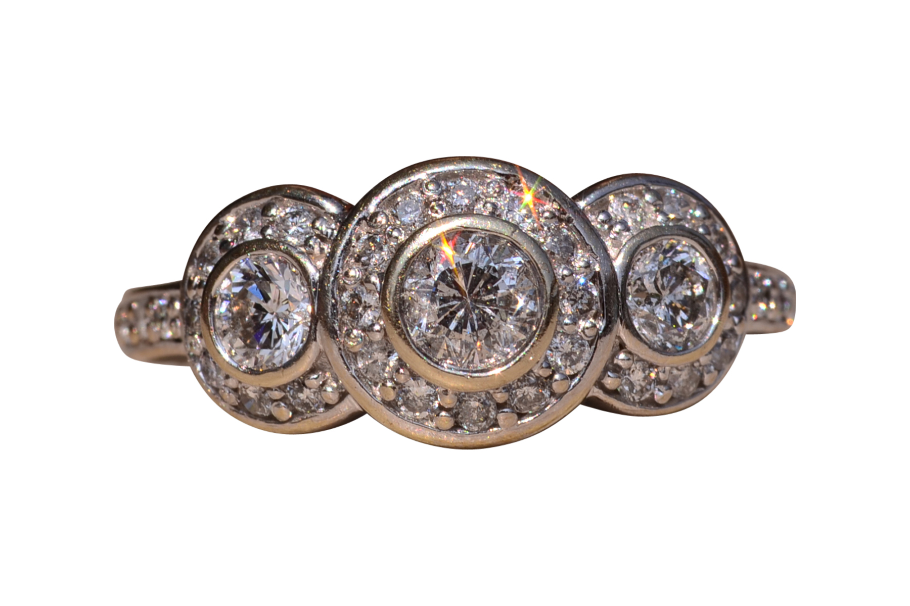 The Coast Road: Three Stone Halo Ring set with Natural Diamonds