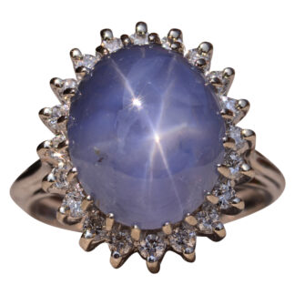 The Asterism: Impressive 12 Carat Star Sapphire and Diamond Halo Ring