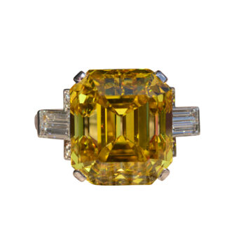 The Amazement: Absolutely Outstanding GIA Graded 19.01 carat Emerald Cut Fancy Vivid Orangy-Yellow Vs2 Diamond Ring