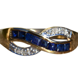 The Lobelville:  Ladies Yellow Gold Diamond and Sapphire Crossover Ring
