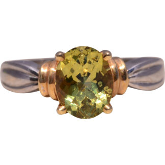 The Two-Tone Glow: Peridot Ring in Yellow and White Gold